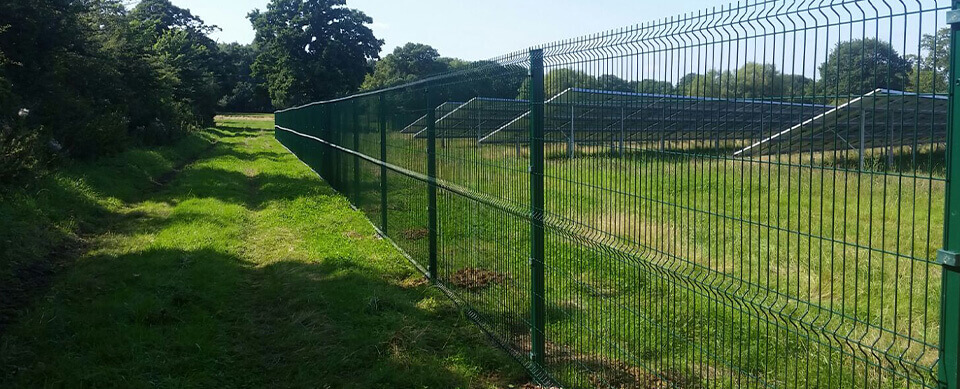 Single-Wire Mesh Fencing Around The Perimeter Of A Solar Farm